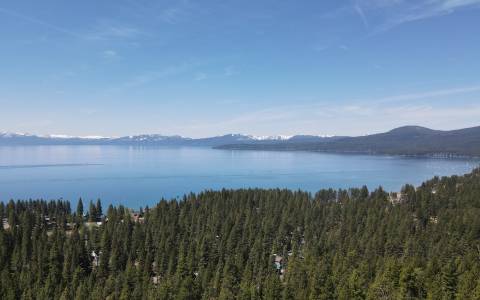 lake tahoe drone shot with snow capped mountains